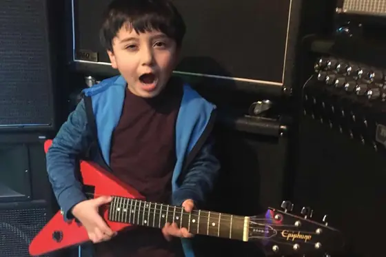 Student at the guitar at Stars Music School, Inwood WV