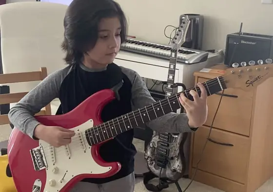 Student at the guitar at Stars Music School, Inwood WV
