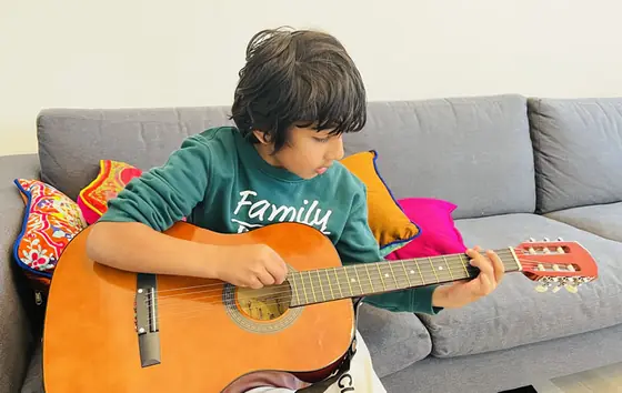 Student at the guitar at Stars Music School, Inwood WV