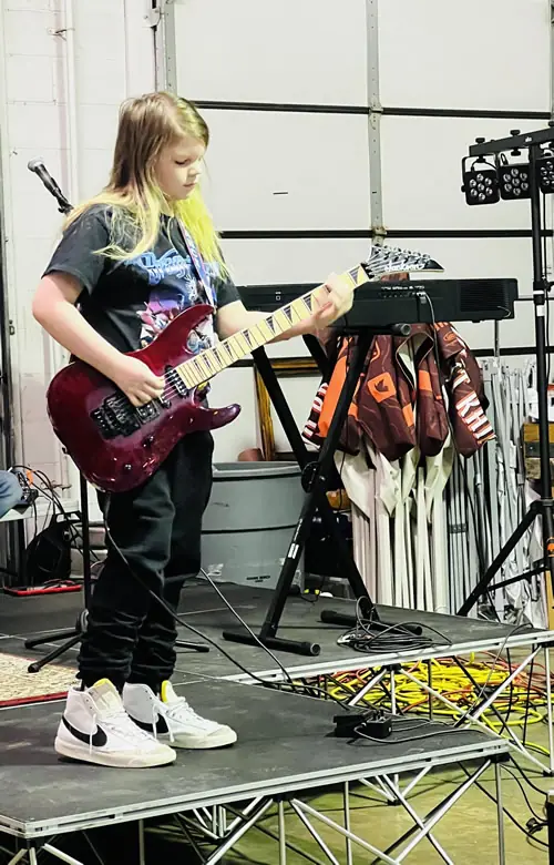Student at the guitar at Stars Music School, Inwood WV