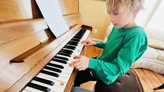 Student at the piano at Stars Music School, Inwood WV