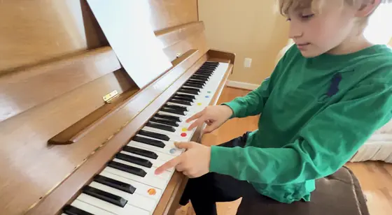 Student at the piano at Stars Music School, Inwood WV